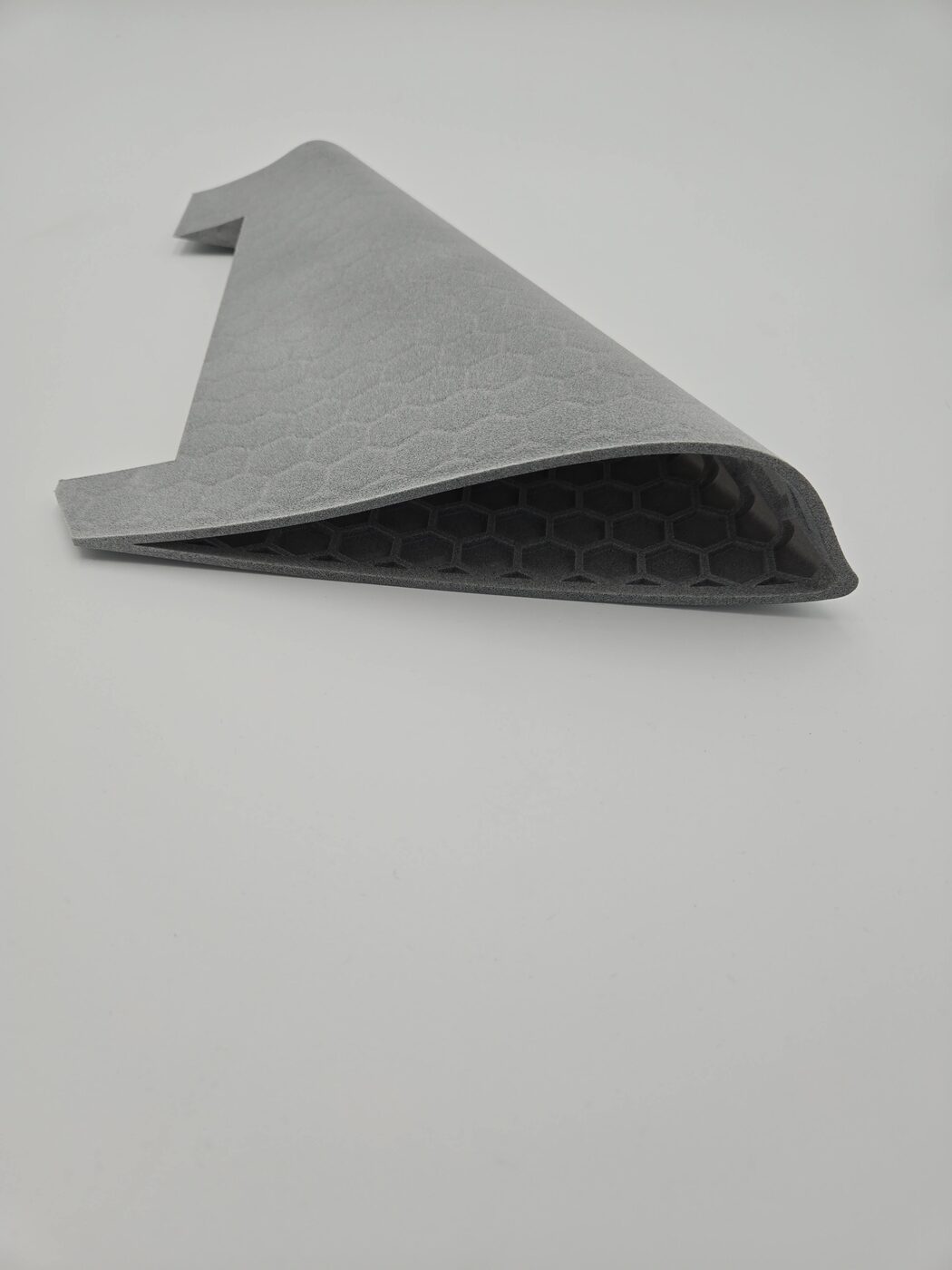 A large lattice-infilled airframe panel for a fixed-wing drone, angled view